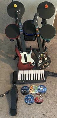 Playstation 3/PS2 Band Hero Rock Band Bundle Drums 2 Guitars Games & Keyboard - Image 1 of 3