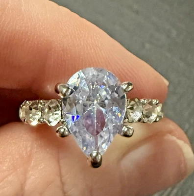 Stunning~ Silver Tone~ Pear Shaped Sparkling Purple Hue Clear Stone Ring~Size 10 - Image 1 of 4