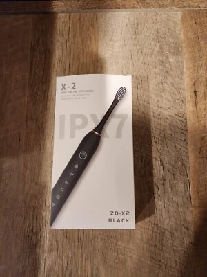 Cepillo de dientes eléctrico sónico X-2 Foto 1 de 2