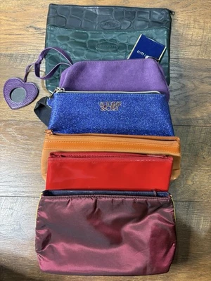 Lote de 7 bolsas de maquillaje Estée Lauder Yves Saint Laurent Ulta Victoria Secret Foto 1 de 4