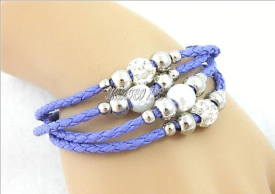 MULTI-4- STRAND PURPLE WEAVED FAUX LEATHER BRACELET SIZE: 6-1/4" TO 7" - Image 1 of 4