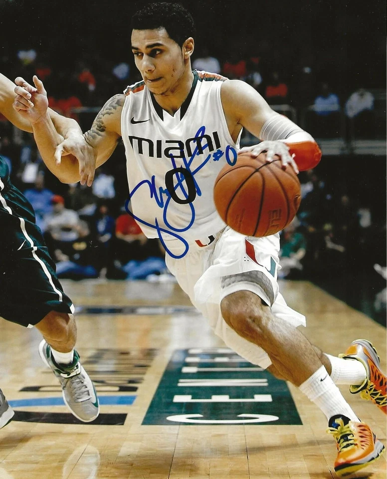 Foto autografiada de 8x10 de los huracanes de Miami firmada por Shane Larkin Canes 2 Foto 1 de 1