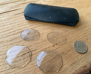 Antique glasses two sets of loose lenses and small black eyeglass case