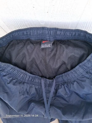 Pantalones cortavientos vintage Nike para hombre cintura 32 azul marino nailon pista Y2K Foto 1 de 3
