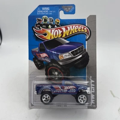 2013 HOT WHEELS BLUE FORD F-150 4X4 HW CITY WORKS SERIES #5/10 Cycling Team - Image 1 of 4