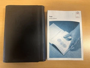 TOYOTA AYGO OWNERS MANUAL AND WALLET 2010-2014 HANDBOOK GUIDE **FREE POSTAGE** - Picture 1 of 1
