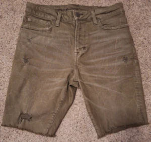 Pantaloncini jeans American Eagle Next Level Flex effetto invecchiato verde oliva taglia 30 - Foto 1 di 8