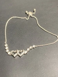 925 STERLING SILVER AND COLORLESS TOPAZ TWO HEARTS BRACELET WITH BOLO CLOSURE - Picture 1 of 7