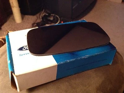 NEW OEM 1984 FORD TEMPO TOPAZ OUTER MIRROR GLASS LEFT HAND FOR CABLE REMOTE - Image 1 of 3