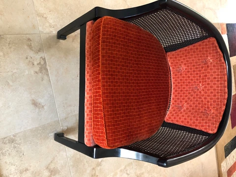 3 Black Cane back chairs with orange cushions Cover