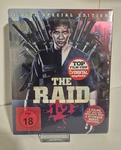 The Raid 1+2 - Steelbook 4 Disc Special Edition - auf BLU RAY/DVD NEU/OVP/OOP - Bild 1 von 2