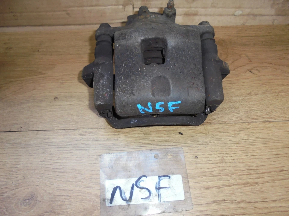 MAZDA 323F 1999 1.5 16V NEARSIDE PASSENGER SIDE FRONT BRAKE CALIPER - Image 1 of 1