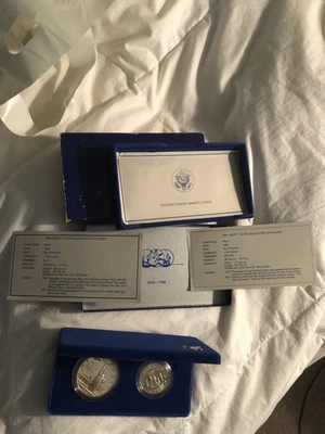 US Mint Liberty Coins 1886-1986 Silver Dollar & Half Dollar COA & CASE  UNC - Image 1 of 4
