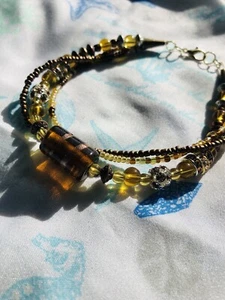 9 1/4” Lg Amber Glass, Brass, Silver Copper& Gold 3 Strand Bracelet Gold Finish  - Picture 1 of 6