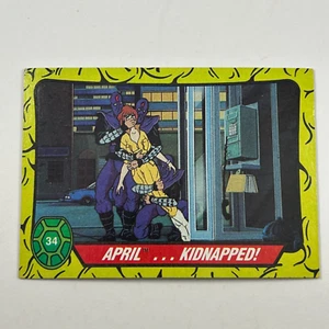 1989 Topps TMNT Teenage Mutant Ninja Turtles #34 abril secuestradas - Imagen 1 de 2