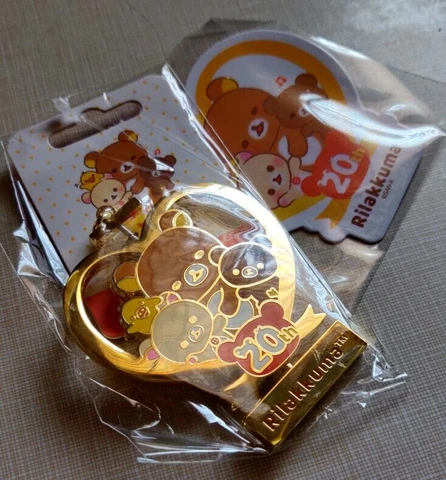 NIB Rilakkuma 20th Anniversary USA TOUR San-X  Spinning Enamel Keychain GOLD Cover