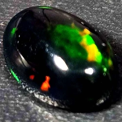 NATURAL AAA+GENUINE COLOR PLAY OVAL CABOCHAN  ETHIOPIAN WELO BLACK OPAL 1.20 CTS - Image 1 of 3