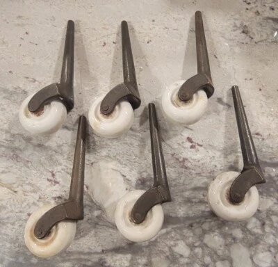 Lote vintage de 6 ruedas/ruedas para muebles de porcelana y hierro fundido usadas Foto 1 de 4