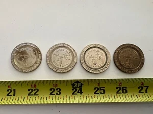 4 MOHEGAN SUN $1 CASINO TOKENS - Picture 1 of 4