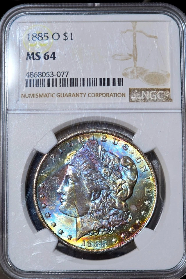 1885-O Morgan Silver Dollar NGC MS64 Rainbow Textile Tab Toned Coin Great Luster - Image 1 of 4