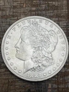 1887 $1 US Morgan Silver Dollar - Picture 1 of 2