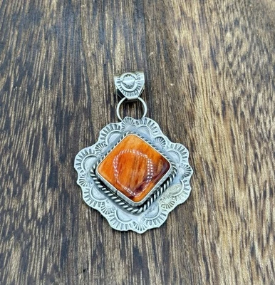 Navajo Handmade Sterling Silver Orange Spiny Oyster Shell Stamped Drop Pendant - Image 1 of 3