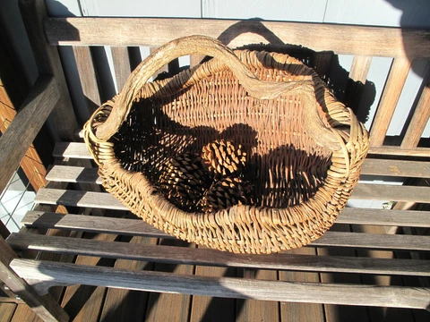 Wicker basket with twisted wood handle for firewood or decor Cover
