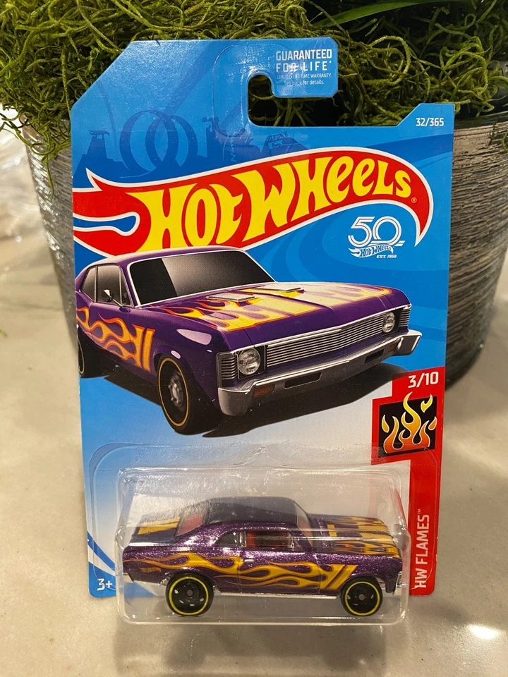 2018 Hot Wheels 32 Hw Fiamme 3/3m68 Chevy Nova Viola W/ Nero DD8 Raggi Ruota - Immagine 1 di 1