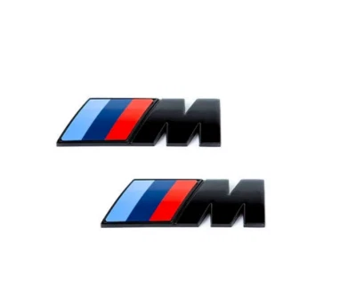 2 emblema parafango originale BMW M nero 45x15 51145A4B372 autoadesivo NUOVO - Immagine 1 di 4