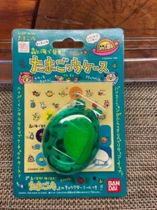 Nuevo en Paquete Estuche de Plástico Tamagotchi Vintage con Pegatinas Bandai 1998 Verde - Imagen 1 de 2