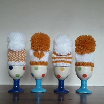 BRAND NEW Gold/Mustard and White Bobble Hats, Egg Cozies, set of 4. - Image 1 of 4