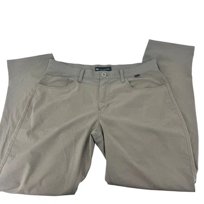 Pantalones de golf TravisMathew para hombre talla 35 tostados elásticos rendimiento frente plano chinos Foto 1 de 4
