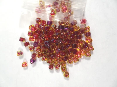 100 Miyuki Transparent Color-Lined Amber & Red Glass TRIANGLE BEADS - Image 1 of 2