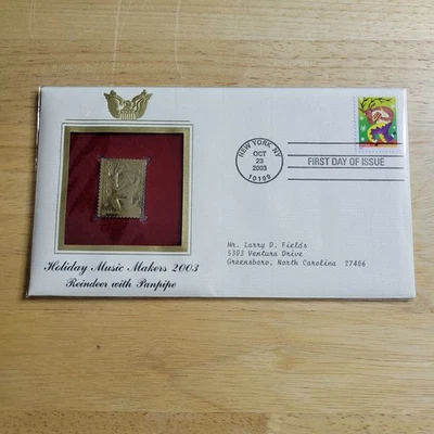 Réplica de sello Holiday Maker 2003 Reindeer Panpipe oro 22kt primer día con tarjeta Foto 1 de 4