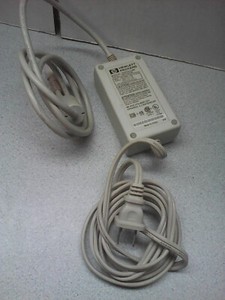 Genuine HP AC Adapter SDD018-N1000 100-120V 0.65A.