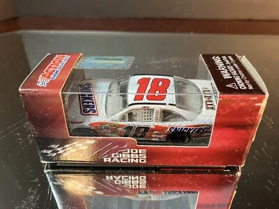 Kyle Busch #18 Snickers 2010 Toyota Camry COT 1:64 Motorsports Authentics - Image 1 of 3