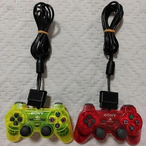 PS2 2 Controladores Esqueleto Amarillo Rojo Transparente SCPH-10010 Dual Shoc... - Imagen 1 de 6
