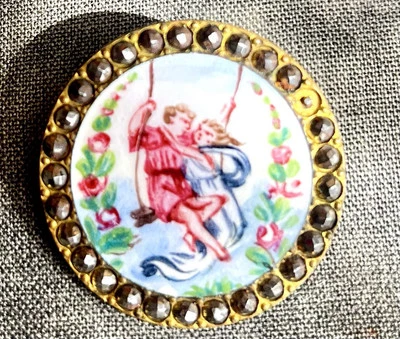 ANTIQUE PAINTED ENAMEL button 1 3/8" Lovers Swinging w/ CUT STEEL BORDER   - Image 1 of 4