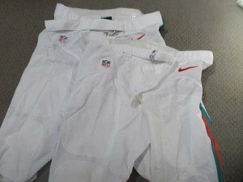 Miami Dolphins throwback team issued uniform pants lot.  Multiple pairs Cover