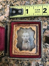 Antique daguerreotype of seated boy in case with abalone shell and gold leaf