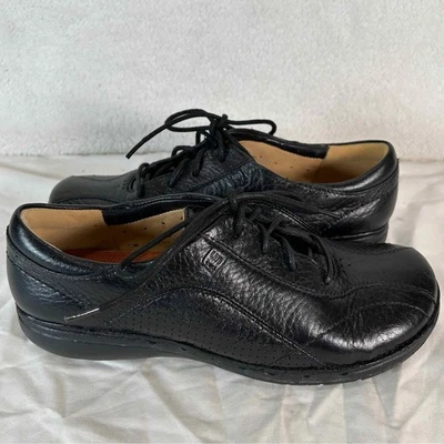 Zapatos informales cómodos Clarks Unstructure de cuero con cordones negros 33524 para mujer 7 M Foto 1 de 4