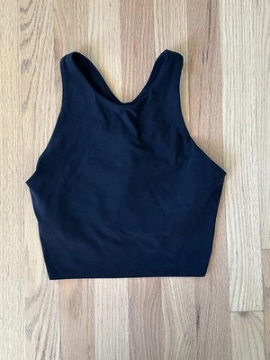 Sujetador deportivo sin mangas Athleta para mujer talla pequeña negro Conscious Crop Longline* Foto 1 de 4