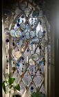Hand made sun catchers with lighthouses sea scapes shells, star fish ships boats