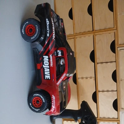 ARRMA MOJAVE GROM MEGA 380 Brushed 1:16 Small-Scale 4x4 Desert Truck rot RTR  - Bild 1 von 4