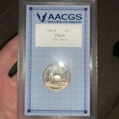 1986s Statue of Liberty Commemorative Silver Half Dollar “ PR65 “ AACGS Grade - Image 1 of 4