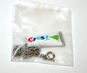 Toy Gum Vending Machine Prize Mini Crest Toothpaste Tube Necklace 1970s NOS New - Picture 1 of 1