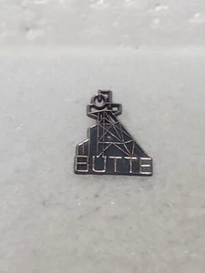 Prendedor de recuerdo de viaje Butte Montana plástico colores negro y cobre - Imagen 1 de 4