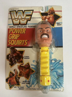 1990 WWF Power Grip Squirts Jake “The Snake” Roberts NUEVO SELLADO RARO WWE Retro Foto 1 de 4