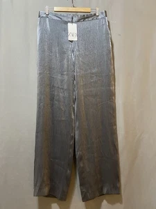 Neu mit Etikett Zara Damenhose Reißverschluss mittelhoch Metallic-Struktur weites Bein Größe L silbergrau - Bild 1 von 14