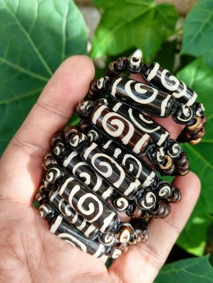 10 pulseras de nailon negras hechas a mano con cuentas de hueso espiral al por mayor Foto 1 de 3